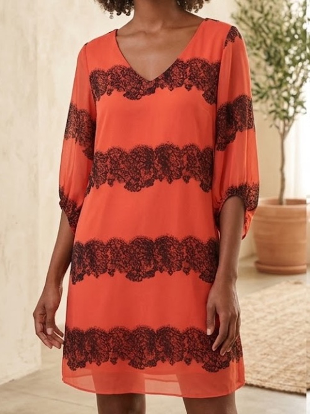 Orange and black print dress